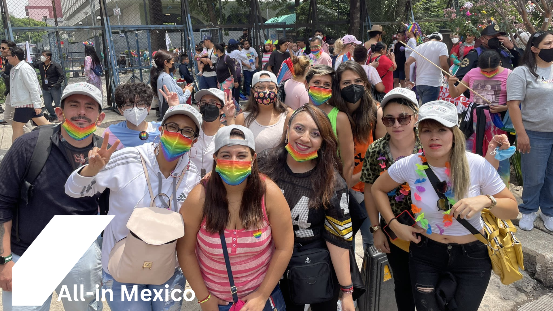 Group photo of Inclusion group: All-in Mexico ERG at Pride wearing rainbow face masks