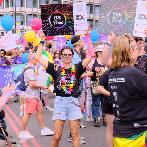 Female RXer at London Pride holding a sign saying 'You are our pride'