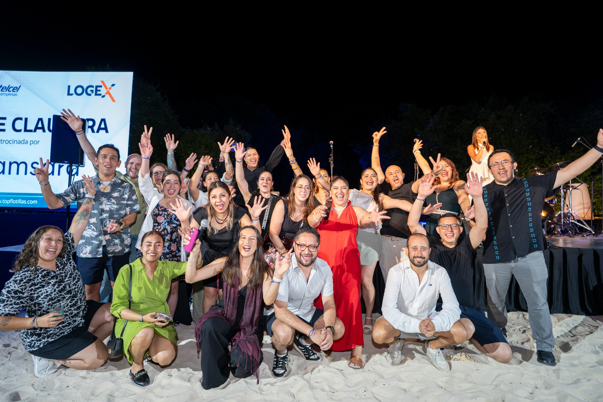 man performing DJ music with crowd during nighttime