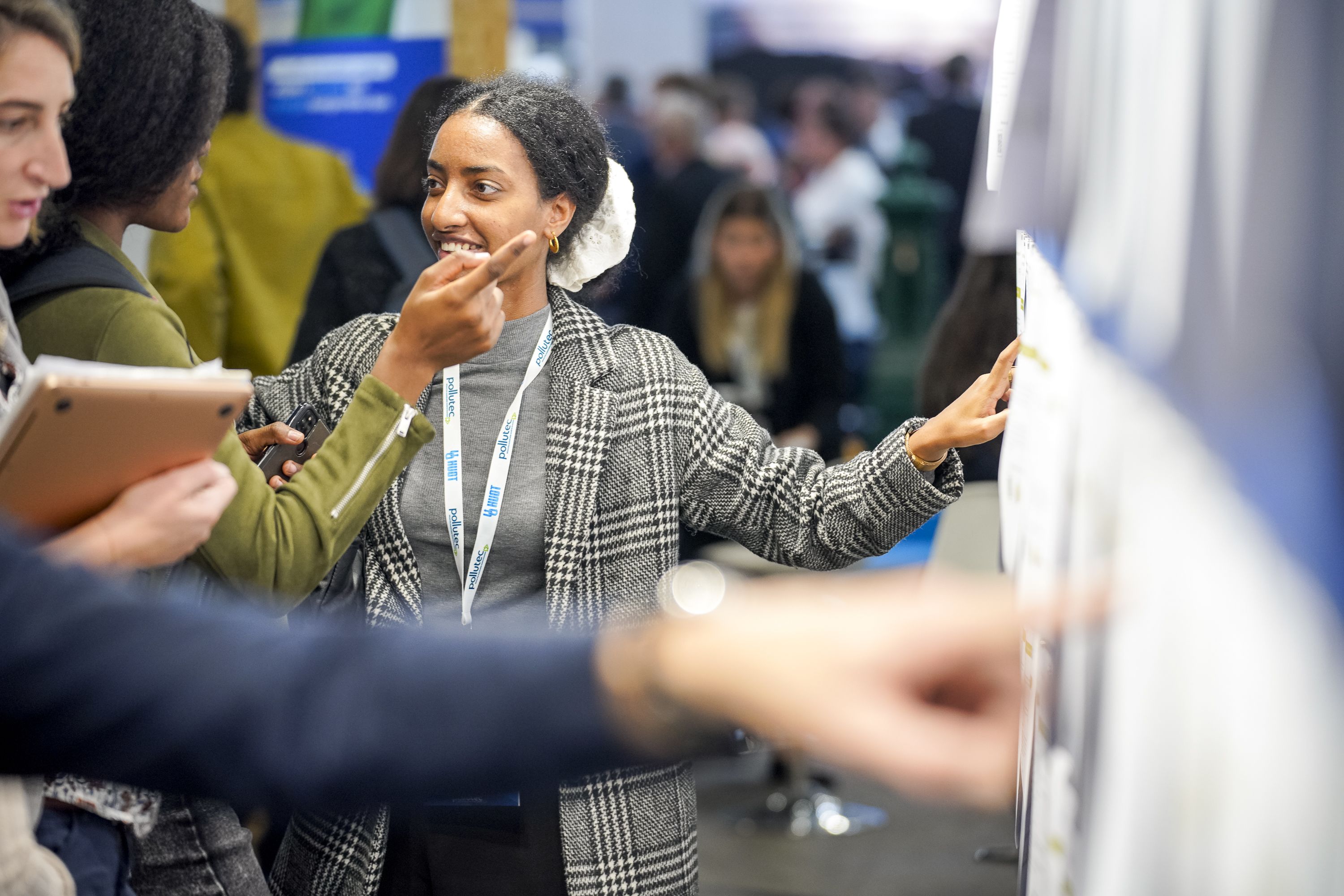 Man addresses group of people sitting in a circle.