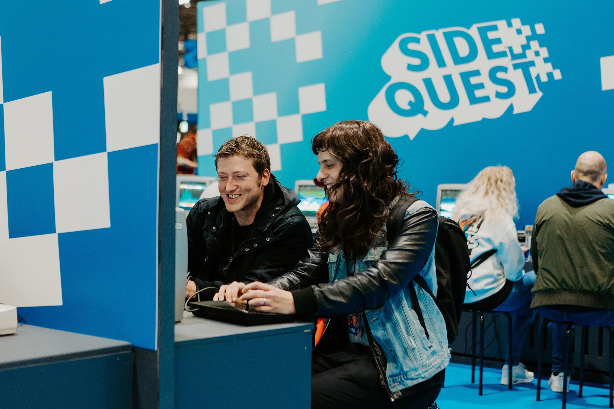 A visually impaired lady enjoying playing side quest using a screen reader